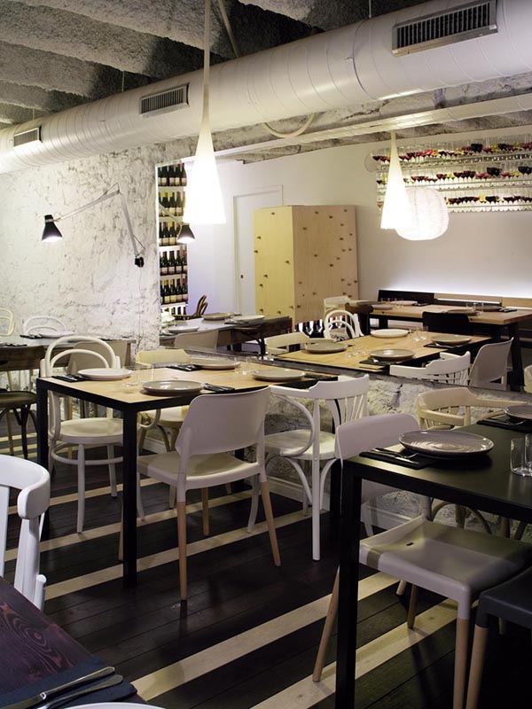 Interiorismo de un restaurante ecléctico inspirado en el vino